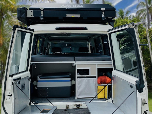 Toyota Landcruiser with opened trunk and equipment